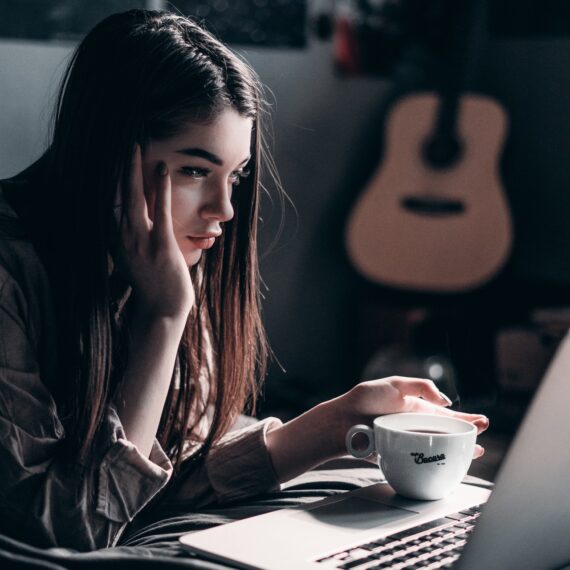 photo-of-woman-lying-on-bed-while-using-laptop-4066041.jpg